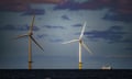 A ship passing wind turbines at RWE's Gwynt y Mor,wind farm off Liverpool Bay, off North Wales.