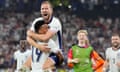 England's Harry Kane celebrates in the arms of teammate Ollie Watkins at the end of the Euro semifinal match against the Netherlands.