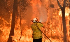 Firefighter conducts back-burning on the NSW central coast in December 2019