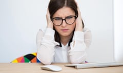 Stressed businesswoman covering her ears with hands