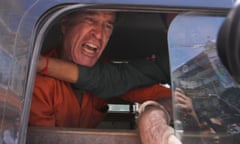 James Ricketson speaks from a prisoner van outside court in Phnom Penh on Friday after he was sentenced to six years’ jail