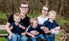 Malcolm and Simone Collins and three of their children sitting on a bench