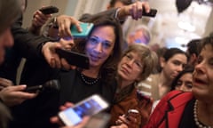 Kamala Harris, surrounded by reporters