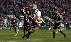 Celtic’s Jozo Simunovic and Rosenborg’s Nicklas Bendtner challenge for the ball during the Champions League third round qualifier.