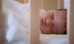 Baby asleep in cot