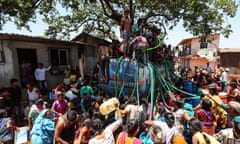 People collect water from a tanker in Bhiwandi, India