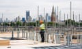 New Homes Under Construction In South London<br>A construction worker stands by scaffolding at the Oval Quarter, a shared ownership, private and social residential housing complex developed by Higgins Group Plc in partnership with Nottinghill Housing and Pinnacle Regeneration Group, in London, U.K., on Monday, Aug. 5, 2013. U.K. house prices rose 0.8 percent in July, from 0.3 percent the previous month, Nationwide Building Society said. Photographer: Simon Dawson/Bloomberg via Getty Images