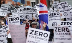 FILES-BRITAIN-POLITICS-LABOUR-ANTISEMITISM-JEWS<br>(FILES) In this file photo taken on April 08, 2018 People hold up placards and Union flags as they gather for a demonstration organised by the Campaign Against Anti-Semitism outside the head office of the British opposition Labour Party in central London on April 8, 2018. - Britain’s main opposition Labour party is in turmoil over mounting allegations of anti-Semitism on leftist leader Jeremy Corbyn’s watch -- and the party’s way of dealing with the issue. The row has exposed deep divisions between Labour members denouncing Corbyn’s complacency, and his hard left supporters defending him to the hilt. Nine MPs have quit the party in recent weeks to sit as independents, with many citing alleged anti-Jewish racism seeping through Labour’s ranks as a primary reason. One of them, the Jewish lawmaker Luciana Berger, received death threats amid a slew of abuse. (Photo by Tolga AKMEN / AFP)TOLGA AKMEN/AFP/Getty Images