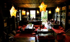 Fairy lights and paper lanterns light up L’Etranger Books and Tea, a bookshop and cafe in Luang Prabang, Laos.