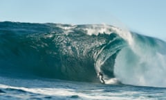 Lizzie Stokely riding an enormous wave