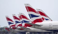 Line of British Airways planes near runway