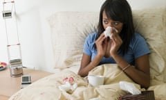 Woman in bed with a cold