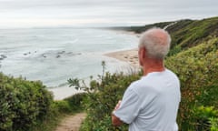 Mark Butler, shark attack survivor looks out over Back Beach on the NSW north coast, Australia