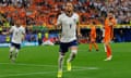 England captain Harry Kane celebrates after scoring his side's equaliser from the penalty spot against the Netherlands