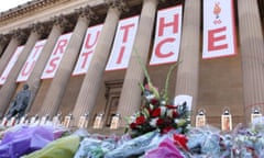 Flowers and banners outside St George’s Hall, Liverpool