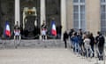 People line up outside the Élysée Palace in Paris to pay tribute to the former French president Jacques Chirac