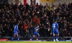 Ali al-Hamadi celebrates in front of the jubilant home supporters after scoring his first goal of the game