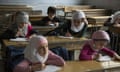 Syrian children attend a class at a primary school in Aleppo's rebel-held eastern district of Shaar on May 7, 2016