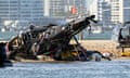 Two helicopters are seen following a collision near Sea World on Monday.