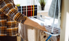 A woman hanging clean laundry