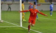 Harry Wilson celebrates scoring for Wales.