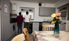 Two women prepare food in a kitchen