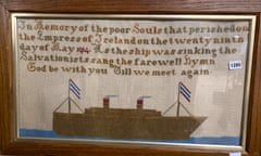 Framed needlework picture of the ship with text above it
