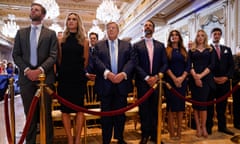 From left, Eric Trump and his wife Lara; Melania’s father Victor Knavs; Donald Trump Jr and his fiancé Kimberly Guilfoyle; and Tiffany Trump and her husband Michael Boulos, listen as former President Donald Trump speaks Mar-a-Lago.