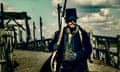 Tom Hardy’s James Delaney holding a musket in Taboo