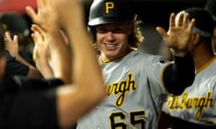 Pittsburgh center fielder Jack Suwinski (65) celebrates with teammates after scoring off of an RBI single by first baseman Alfonso Rivas (6) in the eighth inning of Saturday’s win over Cincinnati.