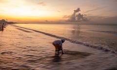 A Balinese man takes part in the Melasti ritual prior to Nyepi 