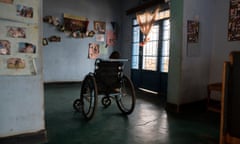 A child waits alone at an orphanage in Kampala. 