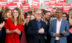 Keir Starmer smiles with Martha O'Neil, Labour’s Carmarthenshire candidate, and Vaughan Gething, the first minister of Wales, in Whitland, Wales, on 3 July.