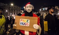 A protester in a Guy Fawkes mask, central London
