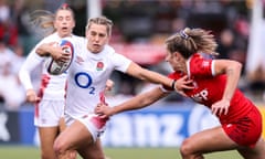 England's Claudia MacDonald (left) attempts to evade Canada's Madison Grant during their meeting in September.
