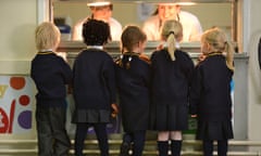 Schoolchildren queueing for food