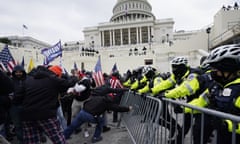 Trump supporters try to break through a police barrier at the Capitol in Washington on 6 January