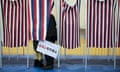 Person inside voting booth at polling place