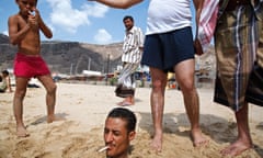 A man buried in the sand on the beach in Aden, Yemen.
Aden, Yemen 2007

From the book: Bystander: A History of Street Photography by Colin Westerbeck and Joel Meyerowitz published by Laurence King
A man buried in the sand on the beach in Aden, Yemen.
Aden, Yemen 2007