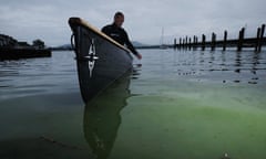 A campaigner takes water samples on Windermere during the lake’s worst summer of algal blooms in 2022.