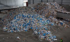 Mayor De Blasio bans the use of plastic in New York City’s public sector<br>BROOKLYN, NEW YORK - APRIL 11: Workers collect the days recycled trash while New York City Mayor Bill De Blasio holds a press conference at a city recycling center processing plant to sign a bill banning single-use plastics in the public sector on April 11, 2019 in Brooklyn, New York. The mayor delivered remarks about the urgency of global warming and the government’s essential role in combating it, including legislation to end the use of plastic products that can be replaced with renewable products. (Photo by Andrew Lichtenstein/Corbis via Getty Images)