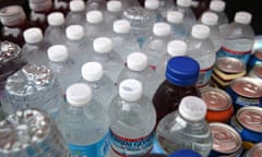 Bottles of water sit in a cooler at a hot dog stand in San Francisco, California