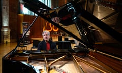 Antonio Pappano looks at the camera while sitting at a piano