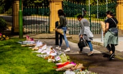 Mourners lay flowers at Government House in Melbourne