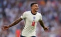 Jesse Lingard celebrates with his arms outstretched after scoring