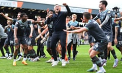 Manager Steven Schumacher (centre) celebrates with his Plymouth players after a 3-1 victory at Port Vale sealed the League One title