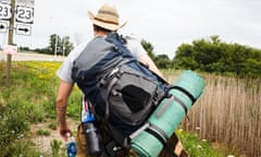 Time to roll. Writer Drew Philip walks towards the first ride out of Michigan. Michigan/Ohio border.