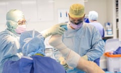 Surgeon Mohammad Faisal performs a knee operation.