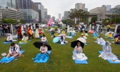 Participants join the International Space Out Competition, an annual event to pick who is the best at doing nothing, in central Seoul