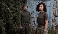 Anton and Iryna standing side by side in military fatigues